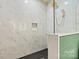 Elegant walk-in shower with marble-style tiling and a black showerhead at 130 Broken Arrow Dr, Statesville, NC 28677