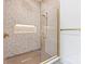 Modern shower with patterned tile, niche, and gold hardware at 130 Broken Arrow Dr, Statesville, NC 28677