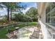 Spacious backyard with a patio area, ideal for relaxing and entertaining guests at 13247 Eastfield Village Ln, Charlotte, NC 28269
