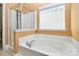 This bathroom features a soaking tub and a separate shower area at 13247 Eastfield Village Ln, Charlotte, NC 28269