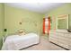 Bright and cheerful bedroom with vibrant colors, decorative decals, and cozy furnishings at 13247 Eastfield Village Ln, Charlotte, NC 28269