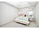 Airy bedroom featuring a tray ceiling and large windows for plenty of natural light at 13247 Eastfield Village Ln, Charlotte, NC 28269