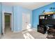 Inviting blue bedroom with a double closet and views into another room at 13247 Eastfield Village Ln, Charlotte, NC 28269