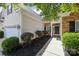 Well-maintained home with stone accents, mature shrubs, and inviting walkway at 13247 Eastfield Village Ln, Charlotte, NC 28269