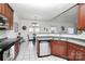 Bright kitchen with stainless steel appliances, tile floors, and breakfast nook with natural light at 13247 Eastfield Village Ln, Charlotte, NC 28269