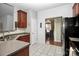 Well-lit kitchen with stainless steel appliances, granite countertops, and tile flooring at 13247 Eastfield Village Ln, Charlotte, NC 28269