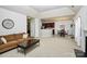 Open-concept living room with fireplace, adjacent dining area, and modern finishes at 13247 Eastfield Village Ln, Charlotte, NC 28269