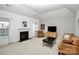 Bright living room featuring a fireplace, ample seating, and neutral decor at 13247 Eastfield Village Ln, Charlotte, NC 28269