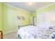 Bedroom featuring a wrought iron bed frame, carpeted floors, and ample closet space at 13402 Mccoy Rd, Huntersville, NC 28078