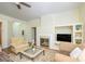 View of the living room featuring hardwood floors, fireplace and neutral-toned furnishings at 13402 Mccoy Rd, Huntersville, NC 28078