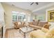 Living room with large windows, hardwood floors, neutral color palette, and comfortable seating at 13402 Mccoy Rd, Huntersville, NC 28078