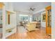 Bright living room featuring hardwood floors, large windows, and neutral decor at 13402 Mccoy Rd, Huntersville, NC 28078