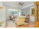 Living room with hardwood floors, plenty of natural light, and comfortable seating area at 13402 Mccoy Rd, Huntersville, NC 28078