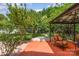 Lush backyard with a patio area, gazebo, and mature trees at 13622 Stringfellow Ln, Charlotte, NC 28278