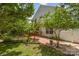 Backyard featuring a patio, privacy fence, and mature landscaping at 13622 Stringfellow Ln, Charlotte, NC 28278