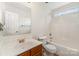 Bathroom with tub/shower, and a single vanity with a wooden cabinet at 13622 Stringfellow Ln, Charlotte, NC 28278