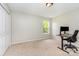 Bedroom featuring neutral walls, plush carpet, and a study area at 13622 Stringfellow Ln, Charlotte, NC 28278