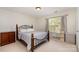 Cozy bedroom features a decorative metal bedframe and bright natural light at 13622 Stringfellow Ln, Charlotte, NC 28278