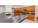Well-equipped kitchen with stainless steel appliances, breakfast bar, and plenty of storage space at 13622 Stringfellow Ln, Charlotte, NC 28278