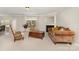 Cozy living room featuring neutral carpet, a fireplace, and comfortable seating, creating a warm and inviting atmosphere at 13622 Stringfellow Ln, Charlotte, NC 28278
