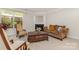 Inviting living room features a fireplace, neutral carpet, and comfortable seating, creating a warm and inviting atmosphere at 13622 Stringfellow Ln, Charlotte, NC 28278