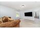 Spacious living room features neutral walls, plush carpet, and plenty of natural light at 13622 Stringfellow Ln, Charlotte, NC 28278