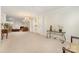 Bright, open living room featuring neutral carpet, elegant chandelier, and ample space for entertaining and relaxation at 13622 Stringfellow Ln, Charlotte, NC 28278