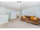 Relaxing living room with a comfortable sofa, neutral walls, and plush carpet at 13622 Stringfellow Ln, Charlotte, NC 28278