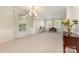 Bright living room with neutral carpet and ample natural light, creating a cozy and inviting space for relaxation at 13622 Stringfellow Ln, Charlotte, NC 28278