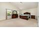 Large main bedroom with vaulted ceiling, neutral walls, and a view of the green outdoors at 13622 Stringfellow Ln, Charlotte, NC 28278