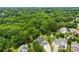 An aerial view of a neighborhood, featuring lush green foliage and well-kept homes at 13832 Queenswater Ln, Charlotte, NC 28273