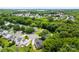 Beautiful aerial view of a neighborhood with lush green trees and well-maintained homes at 13832 Queenswater Ln, Charlotte, NC 28273