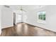 Bright bedroom with hardwood floors, natural light from large windows, and a ceiling fan at 13832 Queenswater Ln, Charlotte, NC 28273