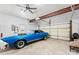 Spacious garage with room for car and storage, ceiling fan and door to backyard at 13832 Queenswater Ln, Charlotte, NC 28273