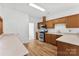 Well-lit kitchen with stainless steel appliances, light countertops, and wooden cabinets at 13832 Queenswater Ln, Charlotte, NC 28273