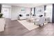 Cozy living room featuring hardwood floors, neutral decor, and large windows with stylish curtains at 147 Commerce Blvd # 0003, Lancaster, SC 29720