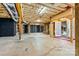 Unfinished basement offers potential with walkout access and exposed ceiling at 1616 Indian Springs Nw Dr, Conover, NC 28613