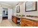 Spacious bathroom featuring double vanity, granite counters, and an adjoining bedroom at 1616 Indian Springs Nw Dr, Conover, NC 28613