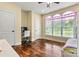 Bright bedroom with hardwood flooring, arched windows, and a dedicated desk space at 1616 Indian Springs Nw Dr, Conover, NC 28613