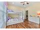 bedroom featuring bunk beds, hardwood floors and natural light from the windows at 1616 Indian Springs Nw Dr, Conover, NC 28613