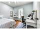 Bedroom featuring natural light, a bed and a desk with a view from a sunny window at 1616 Indian Springs Nw Dr, Conover, NC 28613