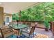 Outdoor covered deck with table and chairs offering a relaxing space at 1616 Indian Springs Nw Dr, Conover, NC 28613