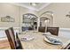 Dining room showcasing an elegant marble table, hardwood floors, and lovely natural light at 1616 Indian Springs Nw Dr, Conover, NC 28613