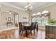 Formal dining room with hardwood floors, arched windows, and elegant decor at 1616 Indian Springs Nw Dr, Conover, NC 28613