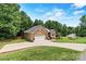 Brick home with a long drive, attached garage, and landscaping at 1616 Indian Springs Nw Dr, Conover, NC 28613