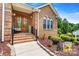 Inviting brick home with a decorative front door, landscaped yard, and curb appeal at 1616 Indian Springs Nw Dr, Conover, NC 28613