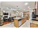 Open concept with a large island with bar stools, stainless appliances, and a view to the living room at 1616 Indian Springs Nw Dr, Conover, NC 28613