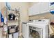 Laundry room featuring a side by side washer and dryer with extra storage at 1616 Indian Springs Nw Dr, Conover, NC 28613
