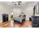 Main bedroom featuring dark wood floors, decorative ceilings, and ensuite bathroom access at 1616 Indian Springs Nw Dr, Conover, NC 28613