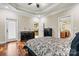 Main bedroom featuring dark wood floors, decorative ceilings, and ensuite bathroom access at 1616 Indian Springs Nw Dr, Conover, NC 28613